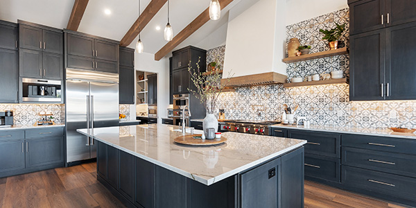 Modern farmhouse kitchen with dark cabinetry and patterned tile